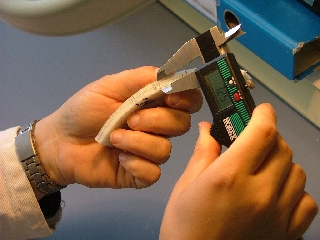 Mean combined thickness is measured using a precision slide gauge