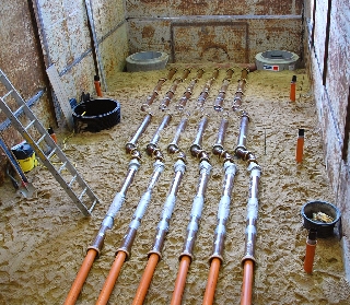 parallel sewer pipelines on bottom of huge test stand