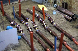 Construction of a sewer system for Comparative Tests at IKT's large-scale test facility