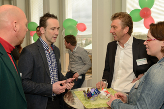 Making new contacts: Peter Brink (2nd from left), head of IKT Netherlands, talking to guests at the opening ceremony