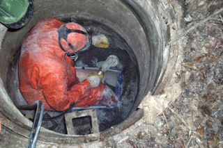 CIPP liner: Taking a sample in a manhole