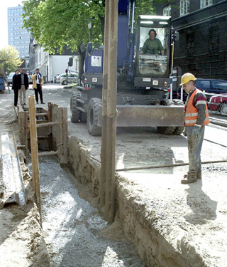 construction site with liquid soil filled trench