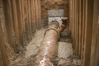 pipe in trench with liquid soil