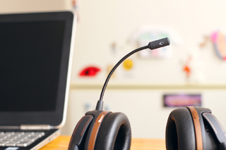 Laptop and headset for web meetings or video telephony