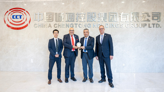IKT and CTHR representatives with the manhole-cover trophy at China Chengtong headquarters