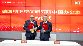 IKT Managing Director Roland W. Waniek and CTHR CEO Cheng Gong holding the signed cooperation agreement in Beijing